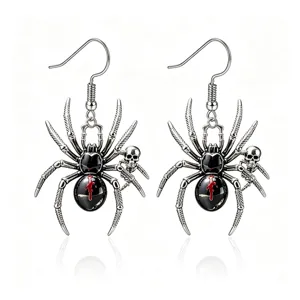 Gothic Halloween spider earrings with red oil detail and skull charm for costume.
