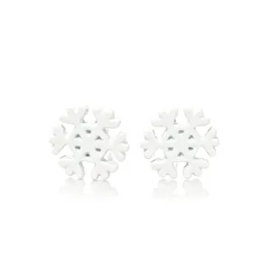 Close-up of elegant white enamel snowflake stud earrings for a festive Christmas season