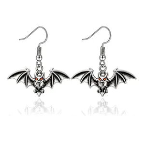 Vintage Halloween bat earrings with spooky red eyes and silver finish details