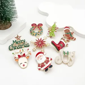 Detailed view of colorful Christmas enamel brooches featuring Santa and reindeer designs