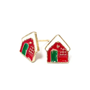 Macro detail view of festive Christmas house stud earrings with red and green enamel coating