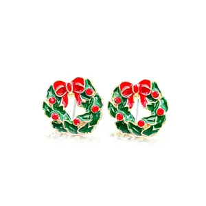 Detail of festive Christmas wreath stud earrings with red bow and green enamel finish.