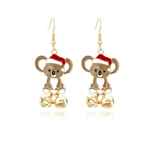 Festive gold-toned koala dangle earrings featuring red enamel Santa hats and bells