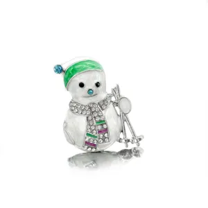 Detailed view of enamel skiing snowman brooch with sparkling rhinestones and green hat