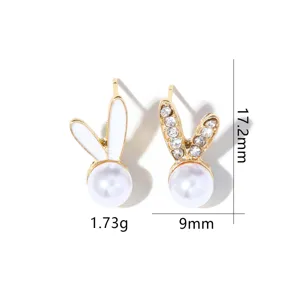 Close-up of pearl bunny stud earrings with 17.2mm height and 9mm width detail