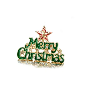Detailed macro view of a green enamel Merry Christmas brooch with crystals and star