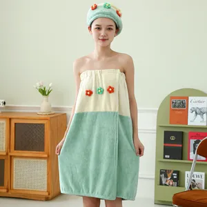 Coral fleece bath dress set detail view featuring lovely flower decor and matching dry hair cap.