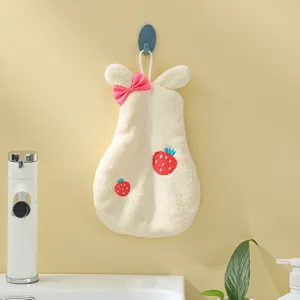 Hanging coral fleece hand towel detail showing rabbit ears and sweet strawberry design.