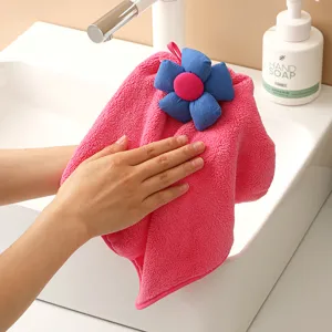 Hanging coral fleece hand towel with cute cartoon flower design, soft and super absorbent.