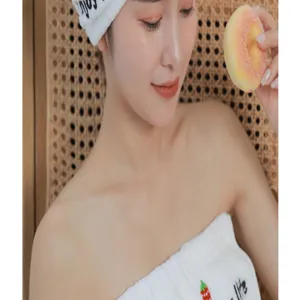 Detailed close-up shot of the soft coral fleece dry hair cap and bath towel set for women.