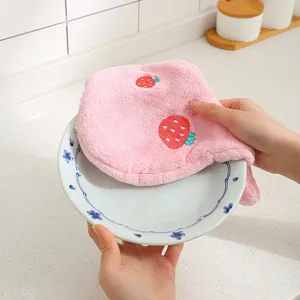 Detail shot of the pink strawberry embroidered coral fleece hand towel, soft kitchen absorbent cloth.