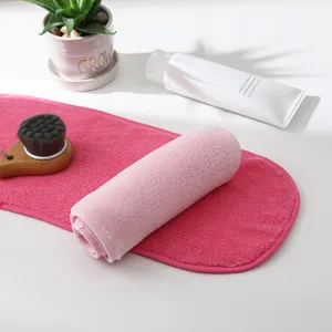 Set of pink microfiber makeup remover towels for gentle facial cleansing and skincare