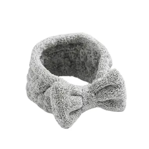 Soft gray plush bow hairband for daily makeup, face washing, and spa skincare routine.