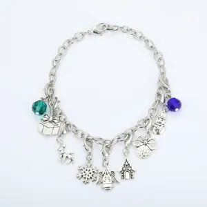 Festive silver charm bracelet featuring Christmas snowflake, reindeer, and angel charms