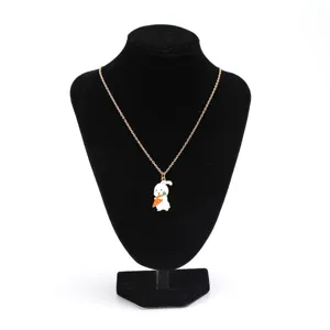 Cute enamel rabbit pendant necklace displayed on a black velvet bust stand