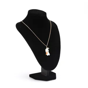 Detail view of cute cartoon rabbit enamel pendant necklace shown on a black display stand