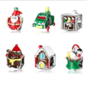 A collection of six colorful Christmas themed enamel beads for DIY charm bracelets.