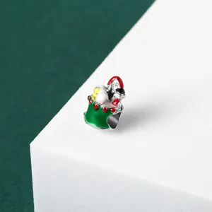 Detailed macro view of a festive Christmas gift bag charm bead for DIY bracelets