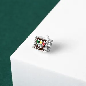 Close-up of silver Christmas jukebox charm bead with colorful enamel for DIY jewelry making