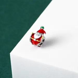 Macro view of a colorful red enamel Santa Claus charm bead for DIY holiday bracelets
