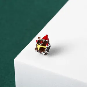 Close-up of a festive Christmas-themed enamel reindeer charm bead for bracelets.