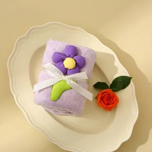 Soft light purple coral fleece gift towel featuring a 3D flower decoration and ribbon