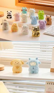 Variety of cute FOFO animal blind box figures in zen praying poses displayed on a desk.