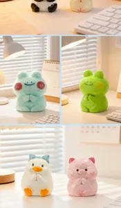 Collection of cute resin animal figures in prayer poses on a cozy desk setup