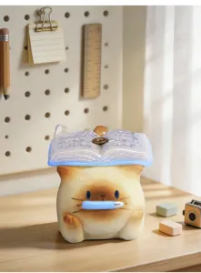 Gros plan détaillé d'une figurine de chat en résine porte-encens tenant un stylo