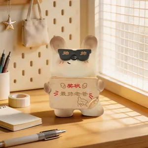 Close-up of a cartoon resin bear figurine with sunglasses and award plaque