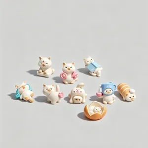 Set of 9 cute creamy cat blind box figurines in various playful poses and accessories