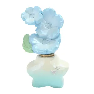 Ornement rotatif de fleur bleue avec base en étoile pour décoration de bureau et cadeau