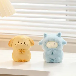 Cute mini animal figurines in meditative prayer pose for creative office desk decor