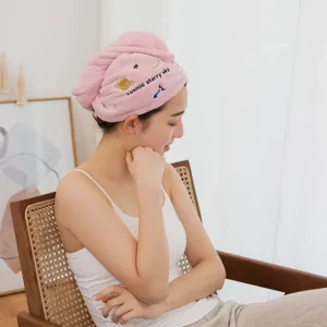 Soft pink coral fleece dry hair cap for women featuring embroidered cosmic starry sky