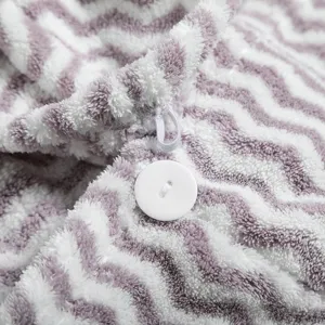 Soft coral fleece hair drying towel with button closure, ultra absorbent and quick drying.