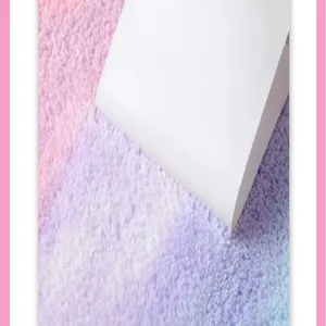Coral fleece dry hair cap fabric detail, soft and absorbent rainbow gradient plush material.