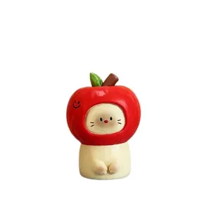 Cute cat figurine wearing red apple hood, collectible blind box desk ornament gift idea