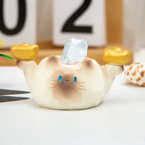 Detailed macro view of cute cat figurine holding gold ingots with blue energy crystal