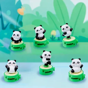 Six cute panda resin figures in various poses on bamboo-style bases.