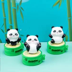 Three adorable panda resin figurines sitting on green bamboo bases with 'PANDA' text detail.