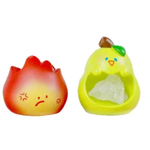 Deux figurines en résine créatives avec cristal, personnages feu grincheux et poire.