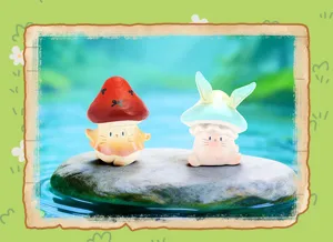 Détail de figurines mignonnes de chat et de lapin en forme de champignon pour le bureau