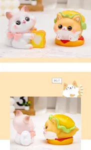 Close-up of cute resin cat figurines with burger and toast themes for desk decor