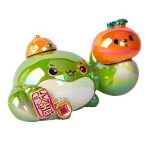 Figurine de crabe porte-bonheur en résine irisée avec ornement d'orange