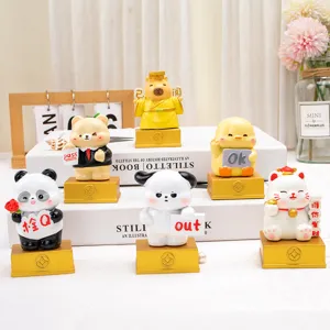 Set of six cartoon resin animal figurines on golden bases for office desk decoration