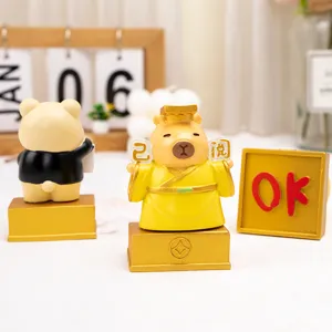 Close-up of cute cartoon resin figurines with OK sign for office desk decoration