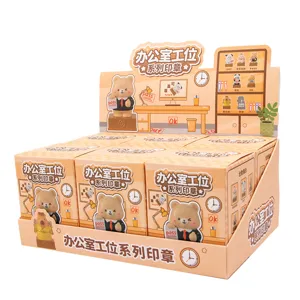Detailed view of a full display set containing cartoon resin office desk stamp blind boxes.