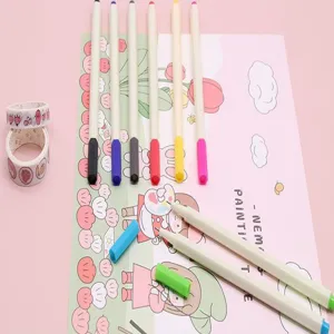 Detail view of 12-color water-based fine-liner pens on pink drawing paper.