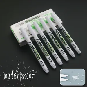 Set of five 1mm white permanent markers with waterproof ink on a dark background