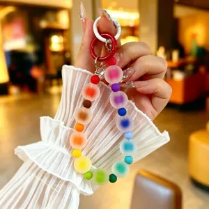 Detailed view of a colorful frosted jelly bead phone charm featuring a vibrant rainbow gradient